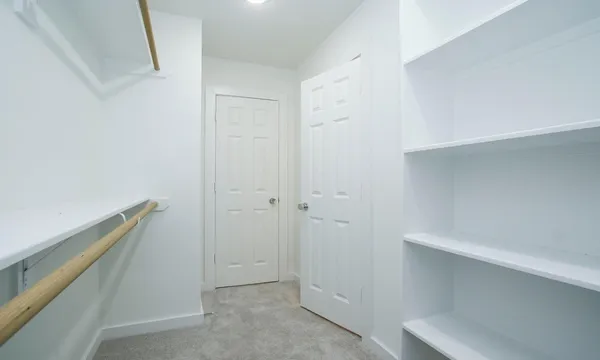 a view of an empty walk in closet