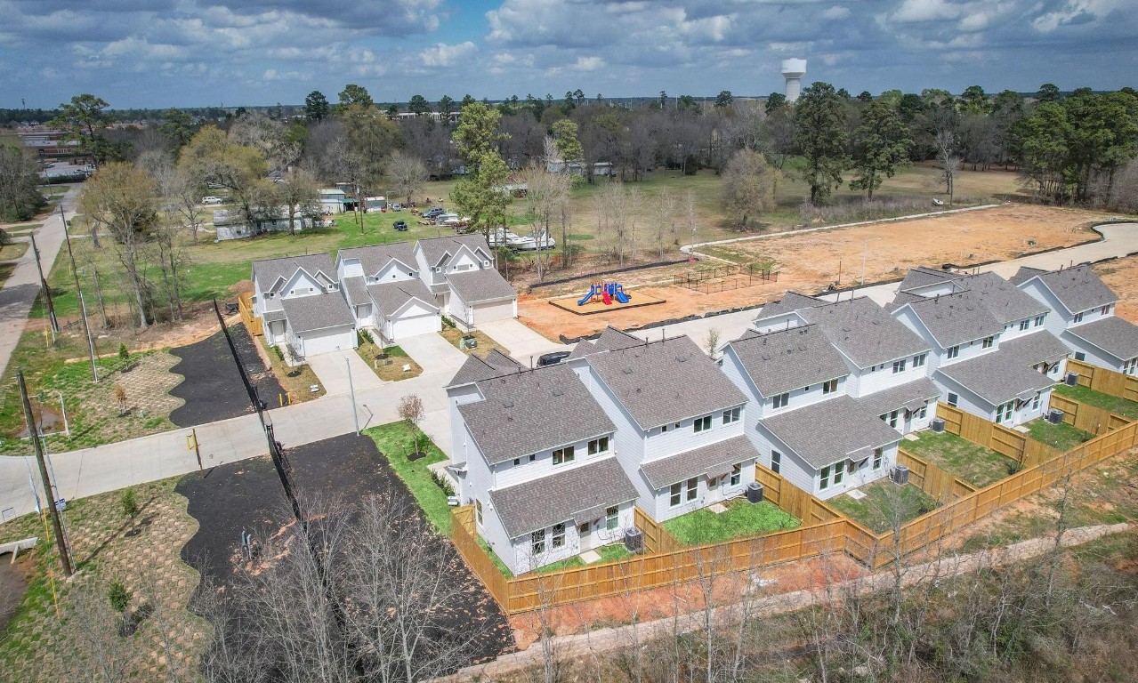 2709 Discovery Trails Conroe, TX 77301 - Photo 2 of 24 an aerial view of a house with outdoor space and lake view