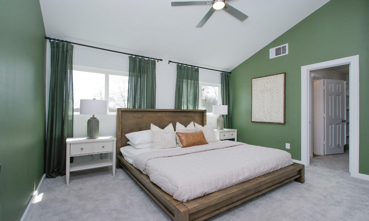 2709 Discovery Trails Conroe, TX 77301 - Photo 9 of 24 a bedroom with a bed and window