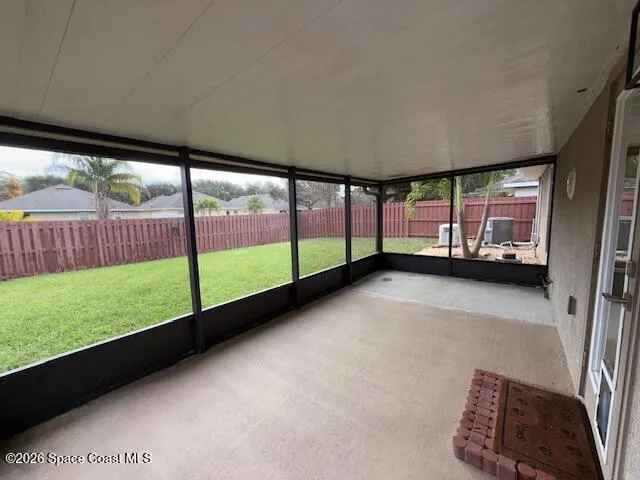 a view of an empty room with windows