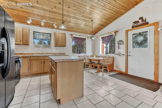 a kitchen with stainless steel appliances granite countertop a sink and cabinets