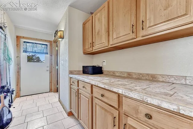 a kitchen with stainless steel appliances granite countertop a sink and cabinets