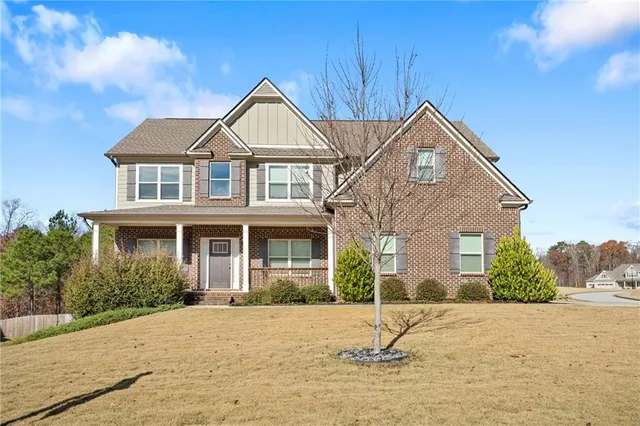 a house with trees in the background