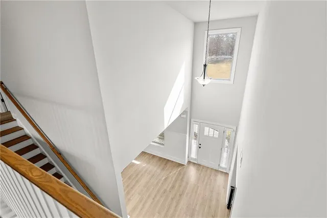 a view of a workspace with furniture and a bookshelf