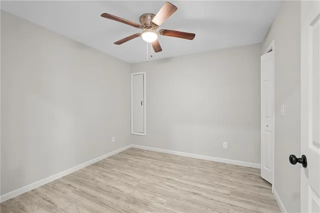 a bathroom with a sink a toilet a mirror a vanity and bathtub