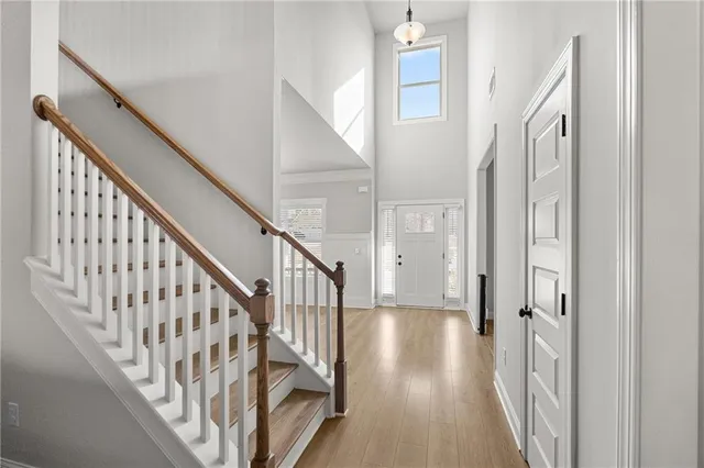 a view of an entryway with wooden floor