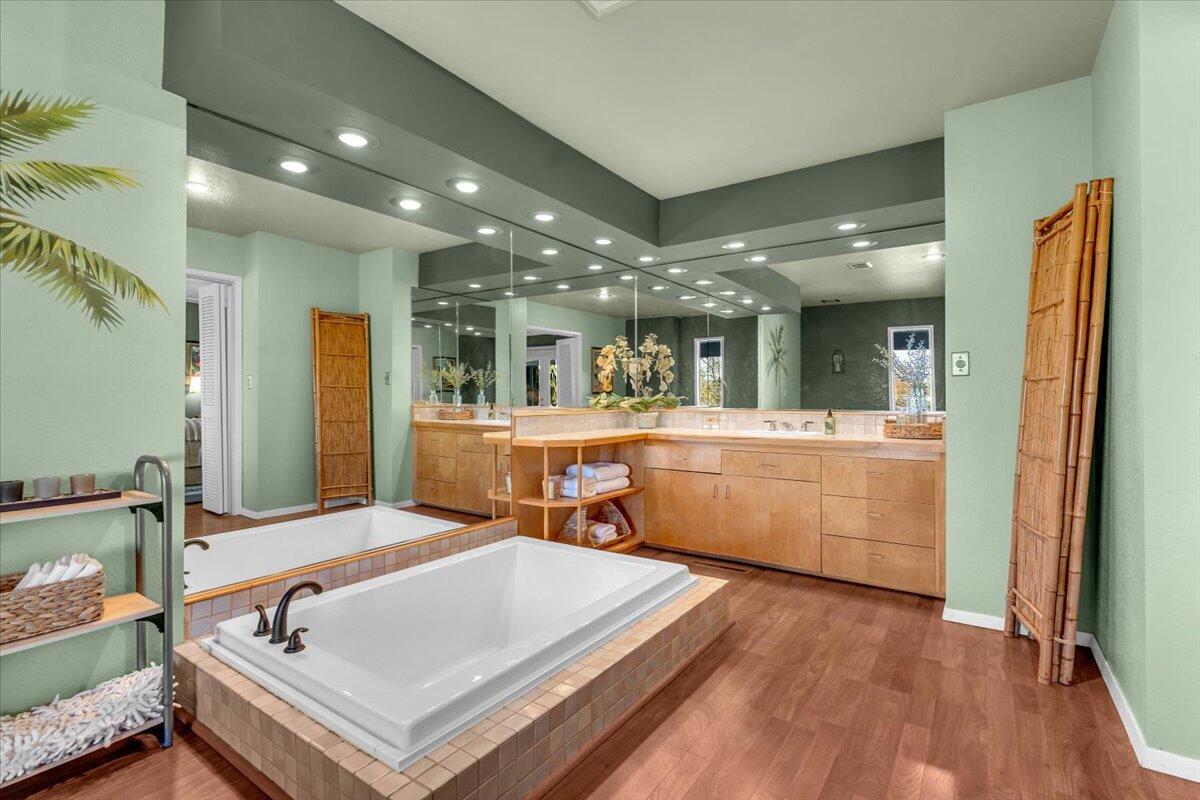 846 Rio Street Red Bluff, CA 96080 - Photo 27 of 73 a spacious bathroom with a sink a large mirror and shower