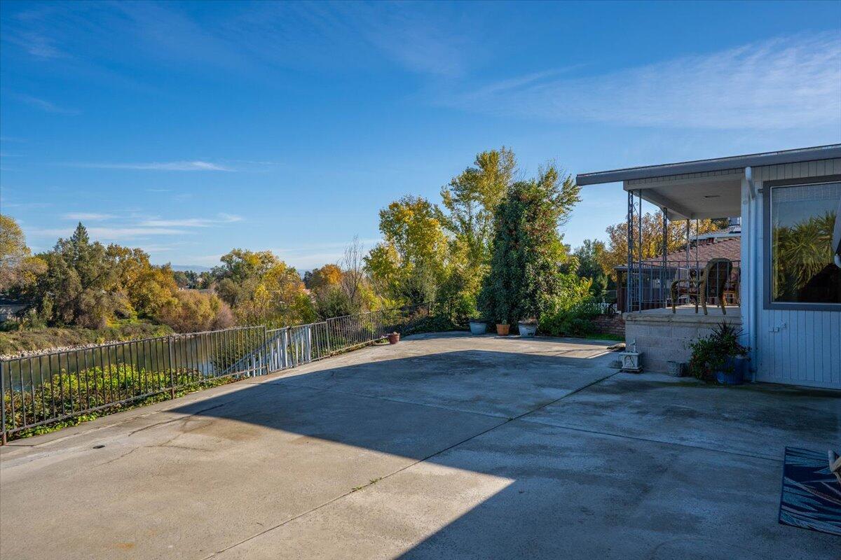 846 Rio Street Red Bluff, CA 96080 - Photo 73 of 73 a view of a lake with a house in the background