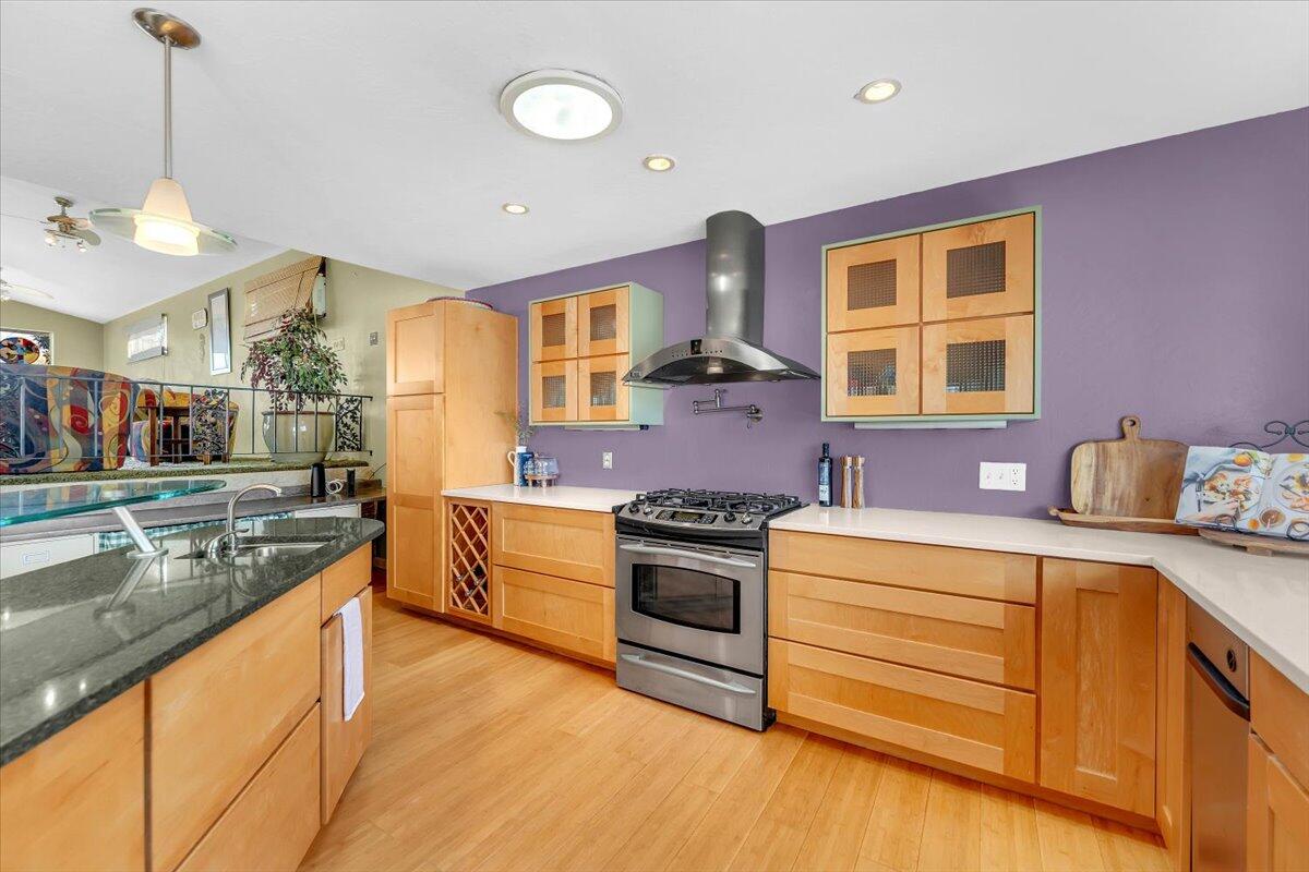 846 Rio Street Red Bluff, CA 96080 - Photo 10 of 73 a kitchen with stainless steel appliances granite countertop a sink stove and refrigerator