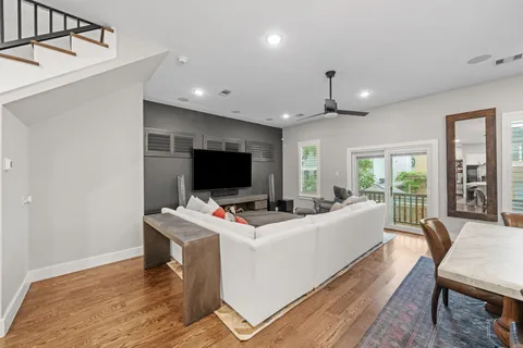 a view of a livingroom with workspace and a window