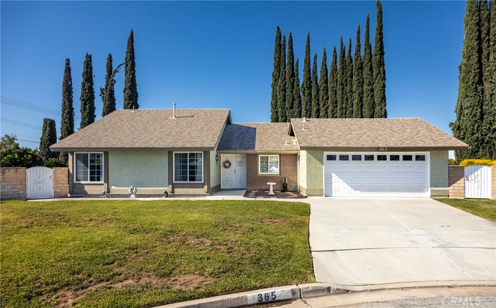 365 Midori Lane Calimesa, CA 92320 - Photo 1 of 26 a view of a house with a yard and sitting area