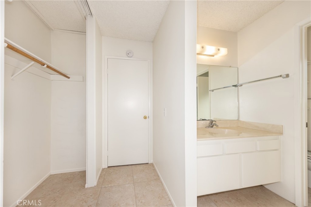 365 Midori Lane Calimesa, CA 92320 - Photo 13 of 26 a bathroom with a sink and a mirror