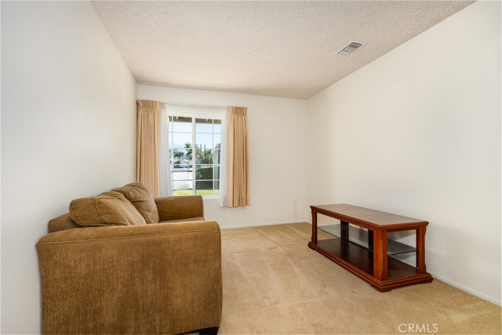 365 Midori Lane Calimesa, CA 92320 - Photo 15 of 26 a living room with furniture and a window