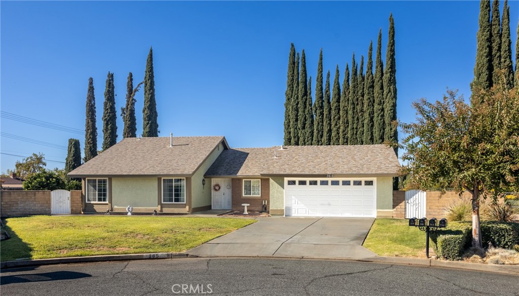 365 Midori Lane Calimesa, CA 92320 - Photo 2 of 26 a view of a house with a garden and pathway