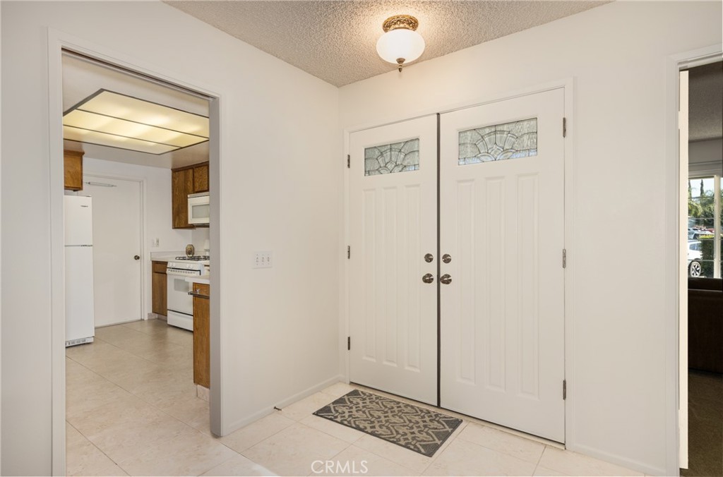 365 Midori Lane Calimesa, CA 92320 - Photo 3 of 26 a view of a hallway with closet and a window