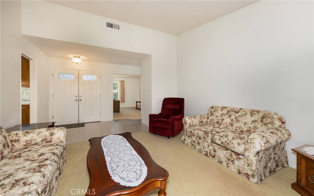 365 Midori Lane Calimesa, CA 92320 - Photo 4 of 26 a bedroom with a bed and a couch