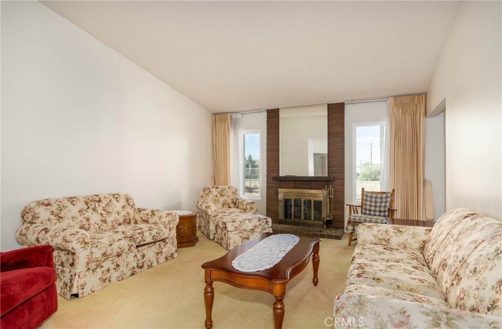 365 Midori Lane Calimesa, CA 92320 - Photo 5 of 26 a living room with furniture fireplace and a flat screen tv