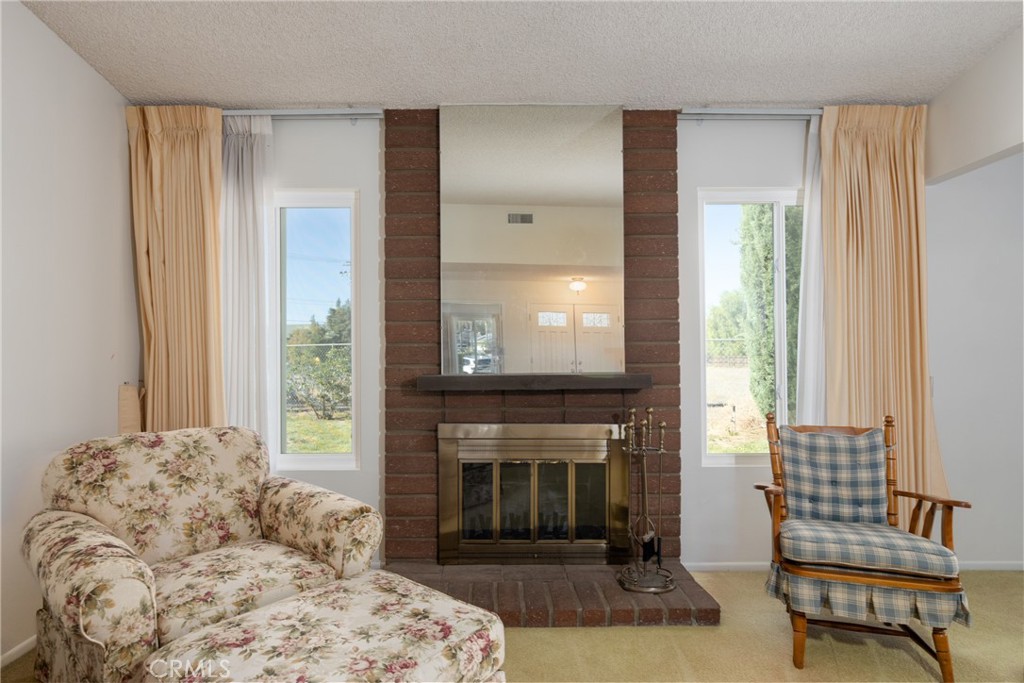 365 Midori Lane Calimesa, CA 92320 - Photo 6 of 26 a living room with furniture and a fireplace
