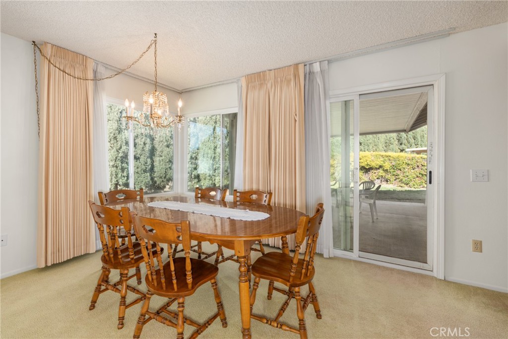 365 Midori Lane Calimesa, CA 92320 - Photo 8 of 26 a view of a dining room with furniture window and outside view