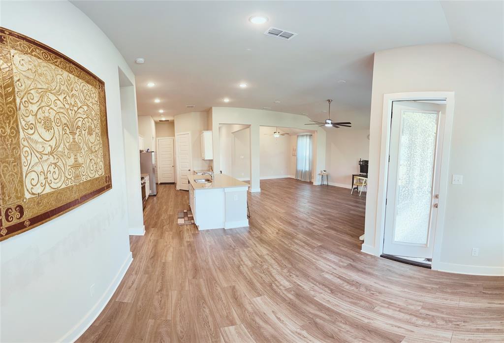 1304 Caprock Drive Forney, TX 75126 - Photo 15 of 15 Kitchen featuring open floor plan, recessed lighting, light wood finished floors, white cabinetry, and ceiling fan