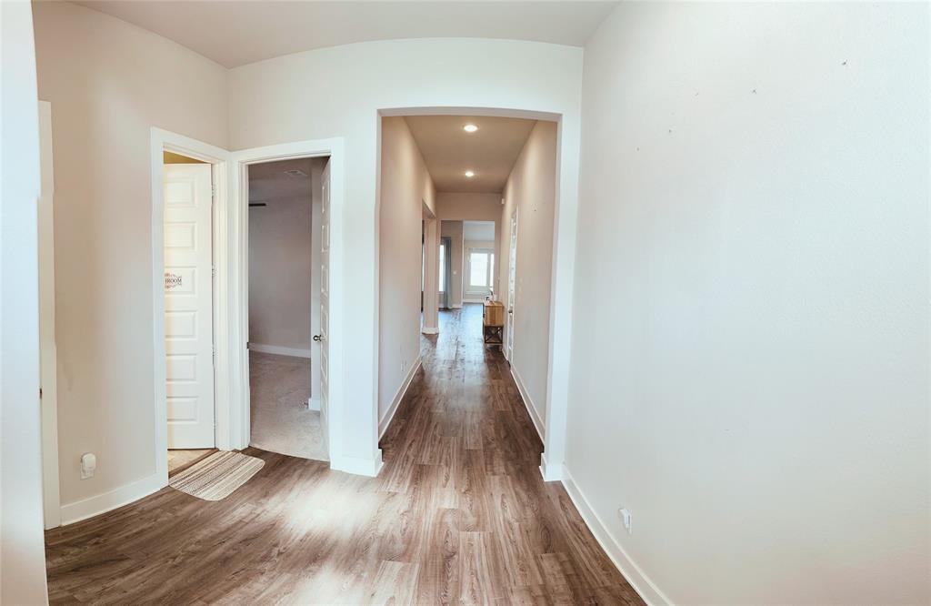 1304 Caprock Drive Forney, TX 75126 - Photo 2 of 15 Corridor with dark wood-style flooring and recessed lighting