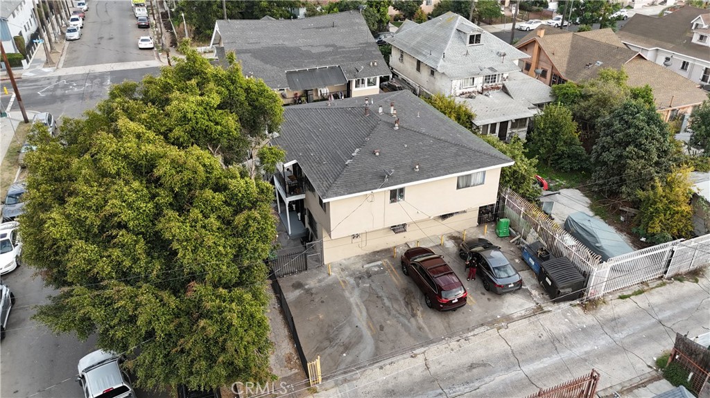 4301 Woodlawn Avenue Los Angeles, CA 90011 - Photo 6 of 8 an aerial view of a house with garden space and street view