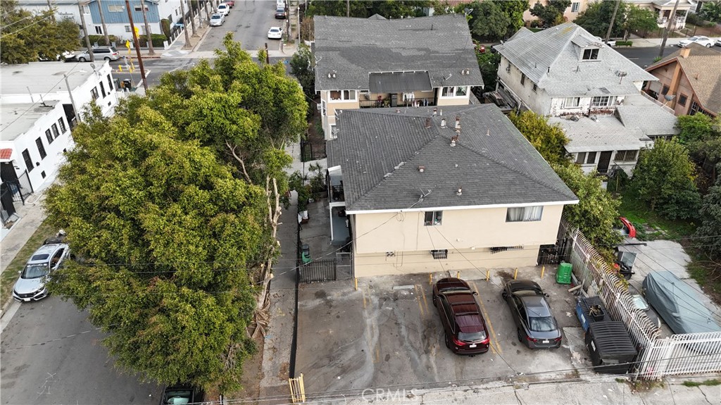 4301 Woodlawn Avenue Los Angeles, CA 90011 - Photo 7 of 8 an aerial view of a house with swimming pool and large trees