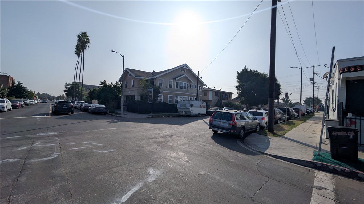 4301 Woodlawn Avenue Los Angeles, CA 90011 - Photo 8 of 8 a view of a city street with couple of cars parked in front of it