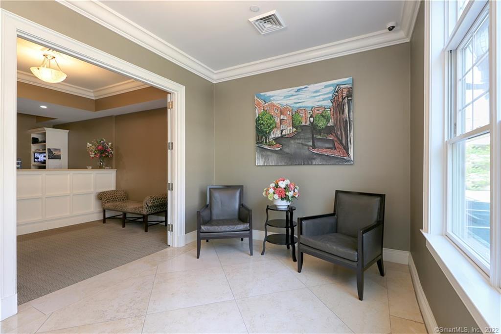 75 Stone Ridge Way, Unit 3E Fairfield, CT 06824 - Photo 14 of 23 Concierge Office and visitor waiting room