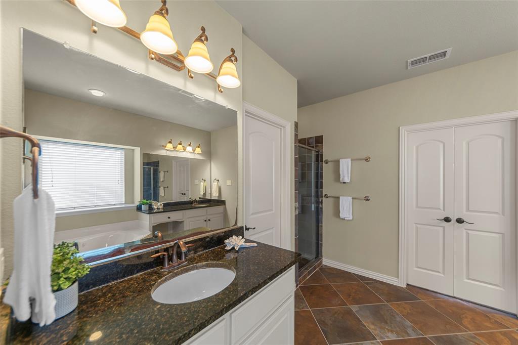 5143 Stream Crest Way Fairview, TX 75069 - Photo 20 of 35 Full bath with vanity, a shower stall, and a bath