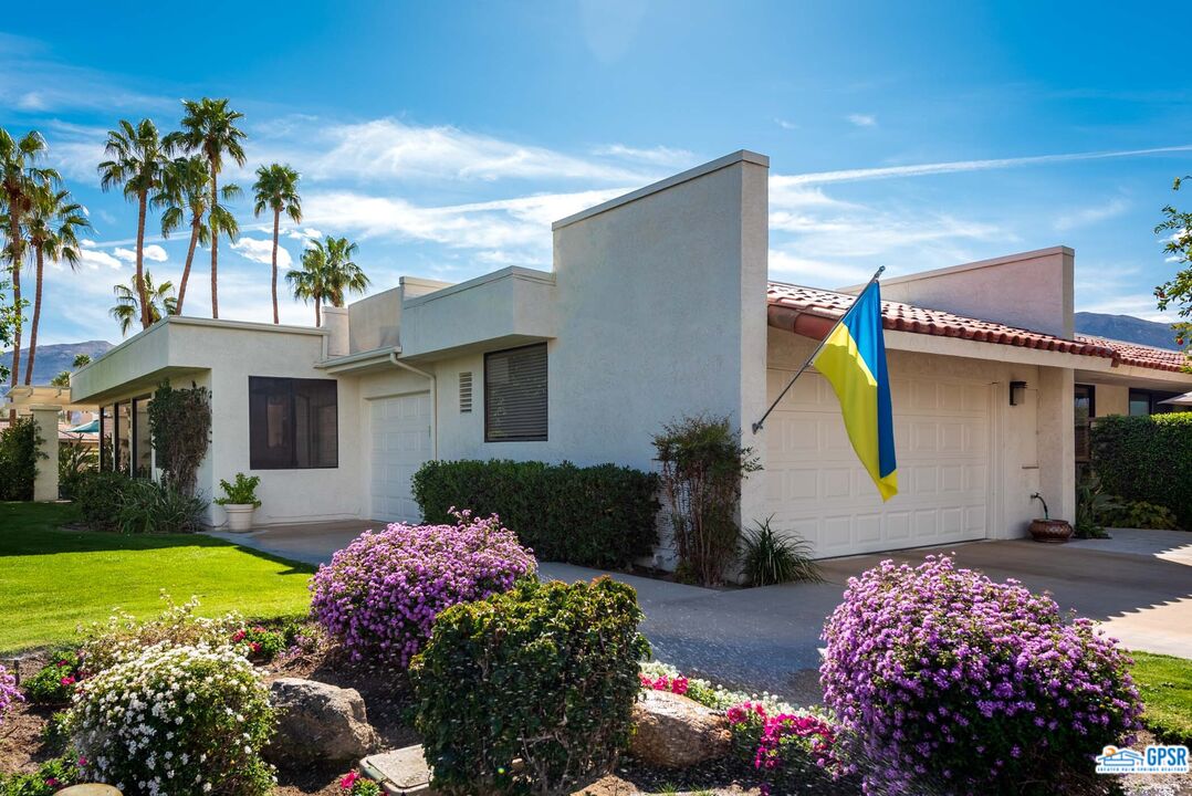 11 Rutgers Court Rancho Mirage, CA 92270 - Photo 3 of 62 a front view of house with yard and outdoor seating