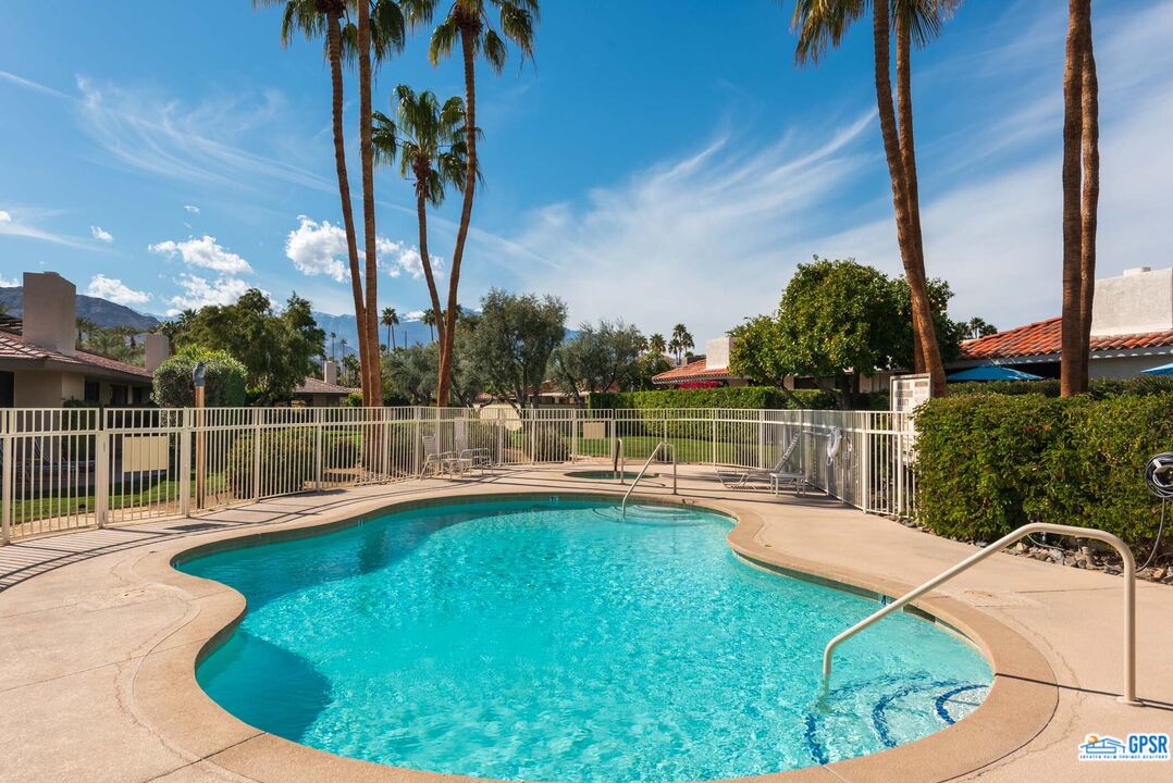 11 Rutgers Court Rancho Mirage, CA 92270 - Photo 46 of 62 a view of a swimming pool with a chair