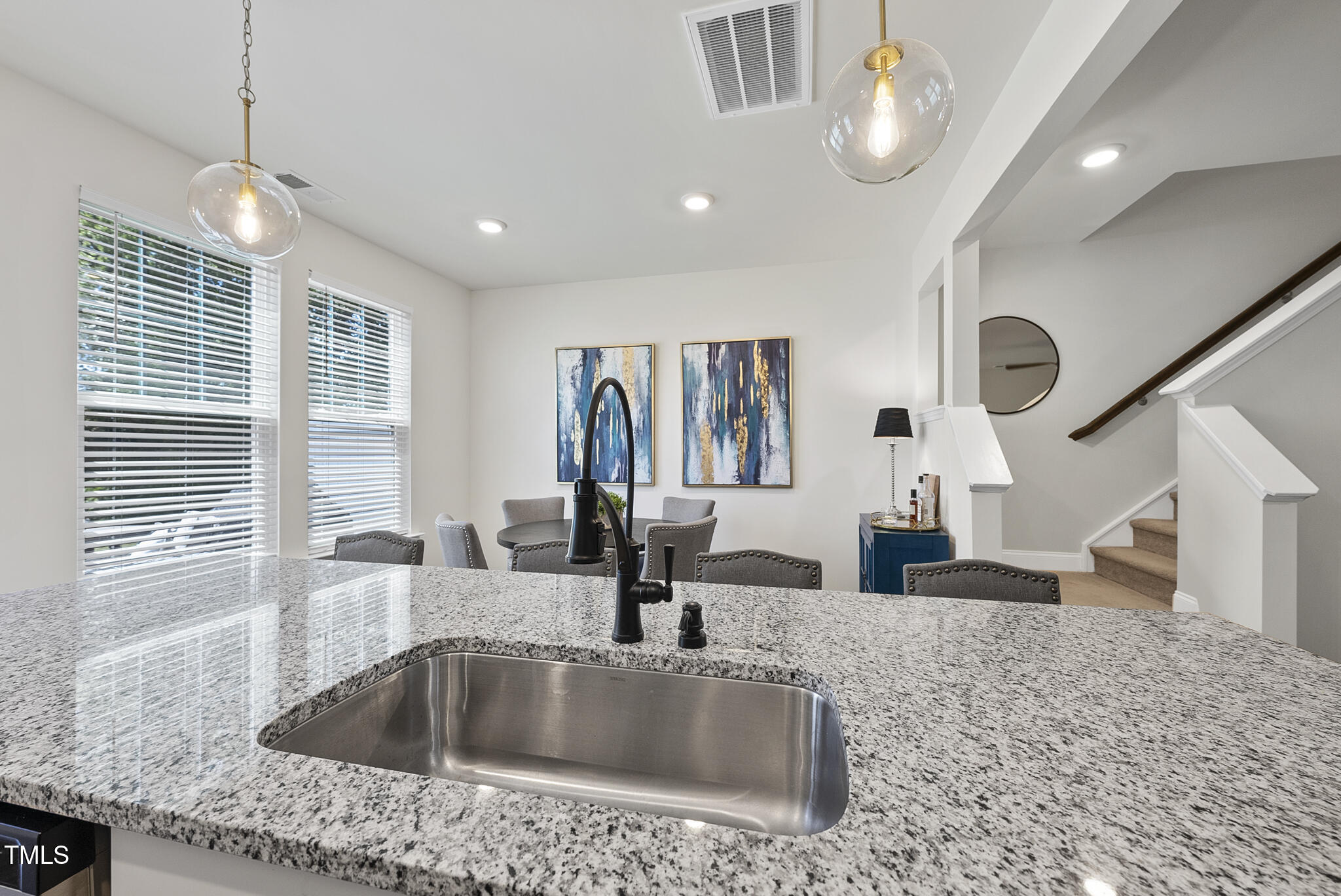 93 Begonia Street Angier, NC 27501 - Photo 14 of 29 a kitchen with kitchen island a sink and a large window