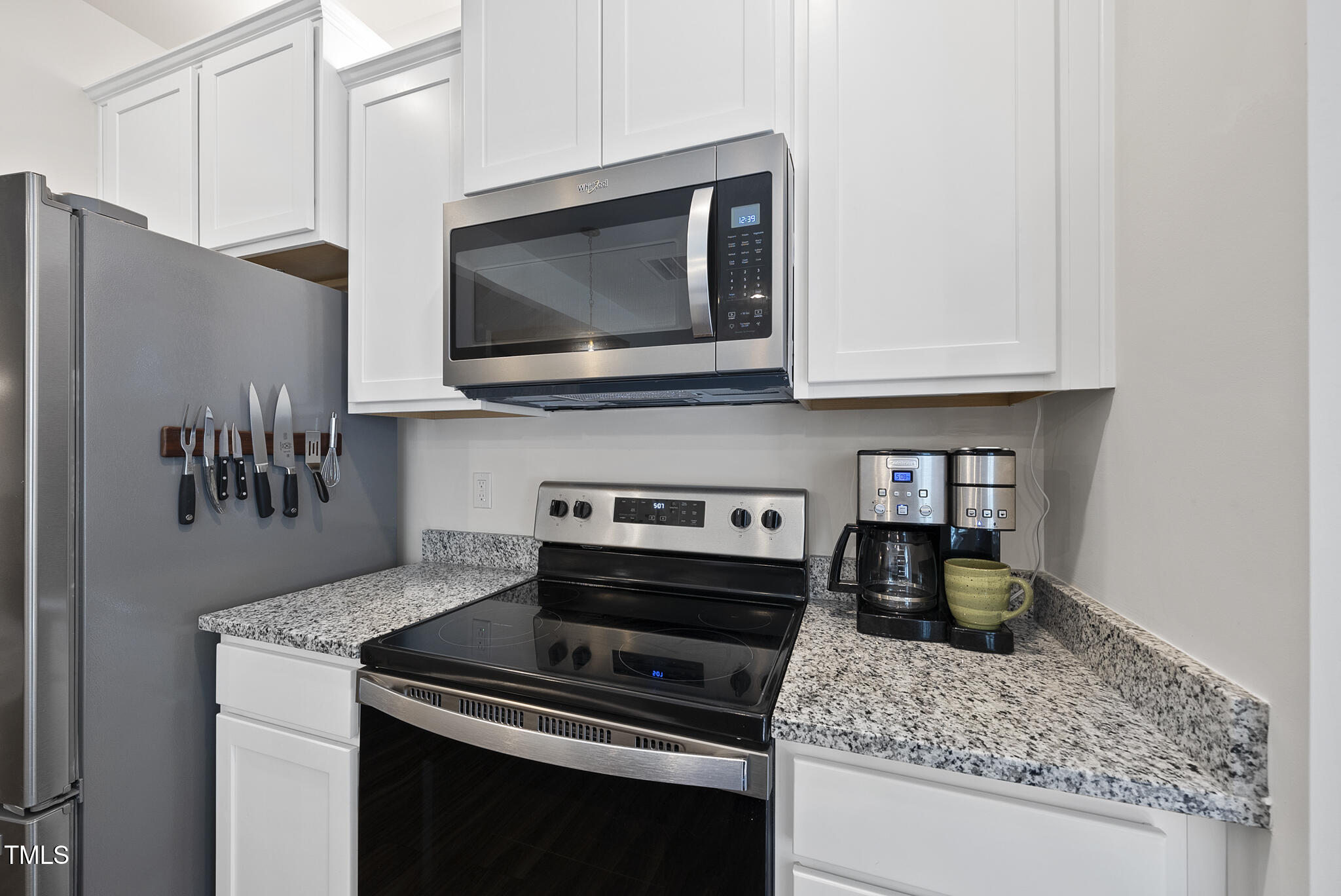 93 Begonia Street Angier, NC 27501 - Photo 15 of 29 a kitchen with a stove and a microwave