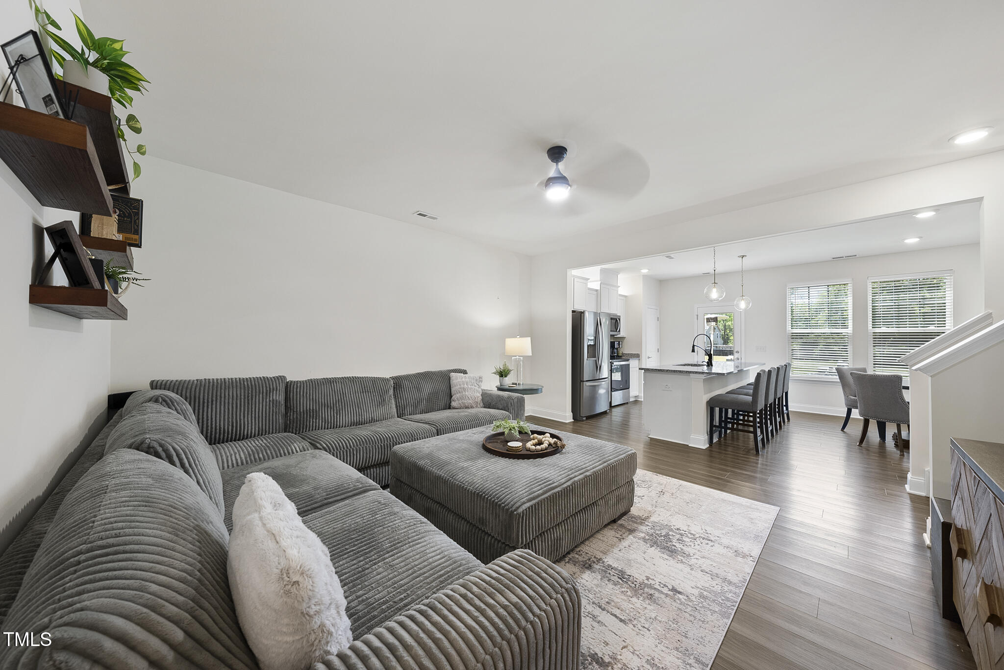 93 Begonia Street Angier, NC 27501 - Photo 2 of 29 a living room with furniture a rug and a flat screen tv