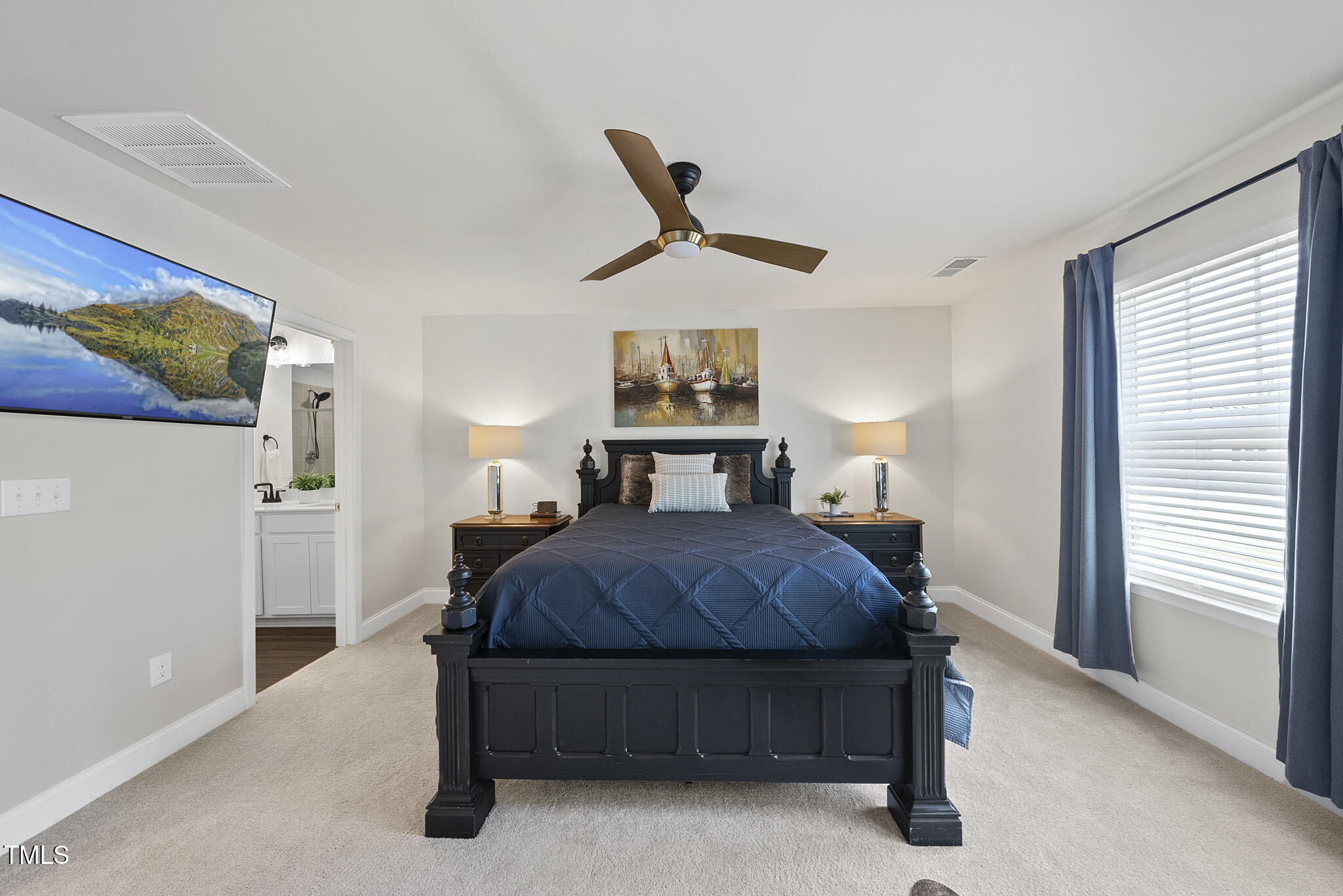 93 Begonia Street Angier, NC 27501 - Photo 20 of 29 a bedroom with a bed a window and wall painting