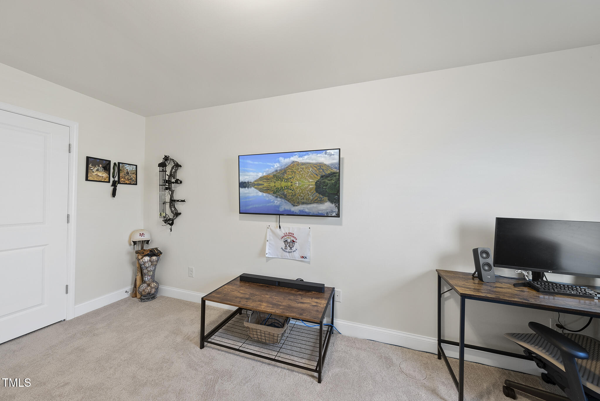 93 Begonia Street Angier, NC 27501 - Photo 24 of 29 a living room with furniture and a flat screen tv