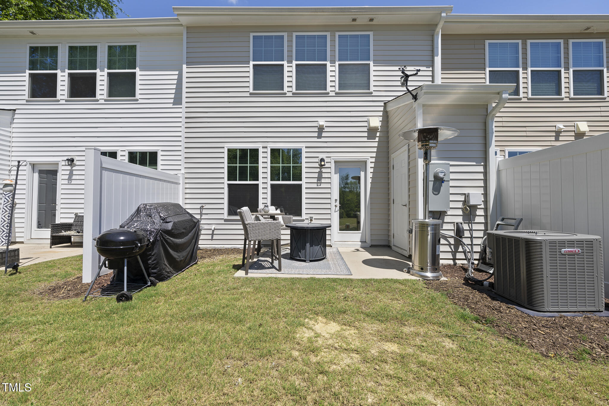 93 Begonia Street Angier, NC 27501 - Photo 28 of 29 a view of a house with a patio and a yard
