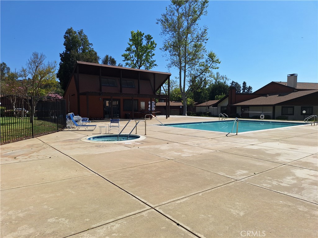 286 Teague Drive San Dimas, CA 91773 - Photo 16 of 16 a wooden bench sitting in front of a house