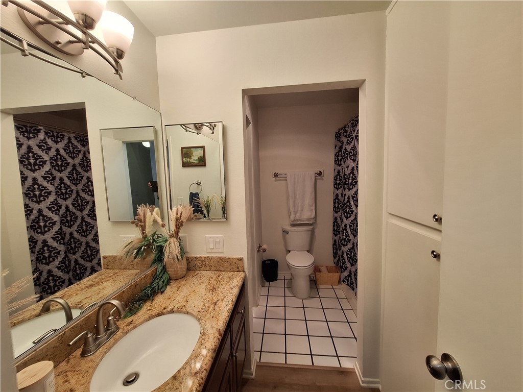 286 Teague Drive San Dimas, CA 91773 - Photo 4 of 16 a spacious bathroom with a granite countertop sink a toilet and shower