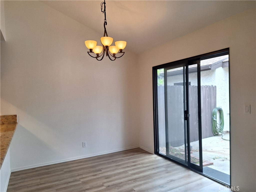 286 Teague Drive San Dimas, CA 91773 - Photo 7 of 16 a view of a room with a large window and chandelier