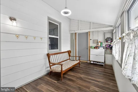 a spacious bedroom with a bed and a window