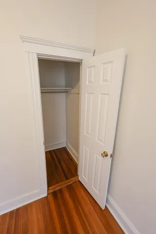 a view of front door with wooden floor
