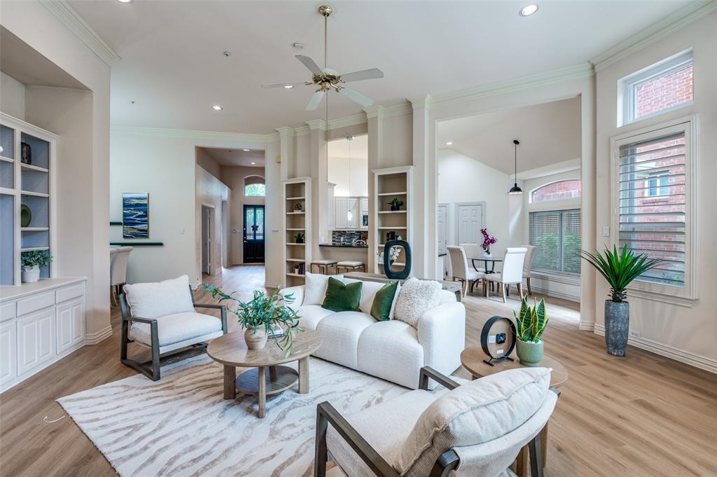 3752 Park Place Addison, TX 75001 - Photo 3 of 25 The spacious living area features light-toned flooring, recessed lighting, and a ceiling fan