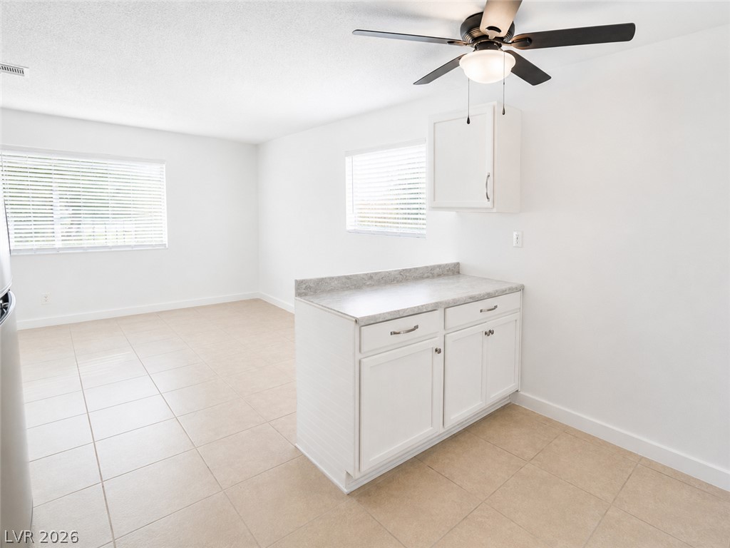 2870 South Sandhill Road Las Vegas, NV 89121 - Photo 25 of 64 A well-lit, open-concept area featuring ample cabinet space and ceramic tile flooring.