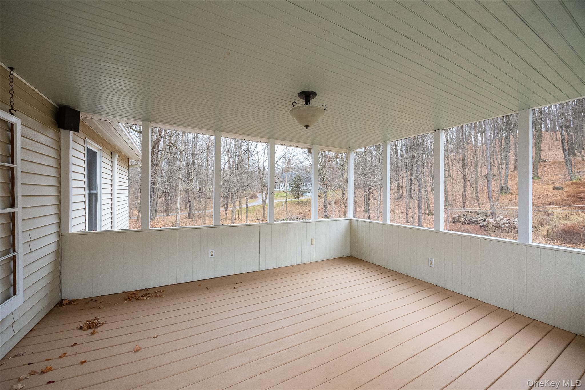 26 St Paul Road Red Hook, NY 12571 - Photo 23 of 35 an empty room with wooden floor and windows