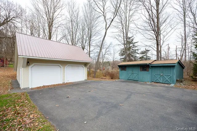 a view of a patio with wooden fence