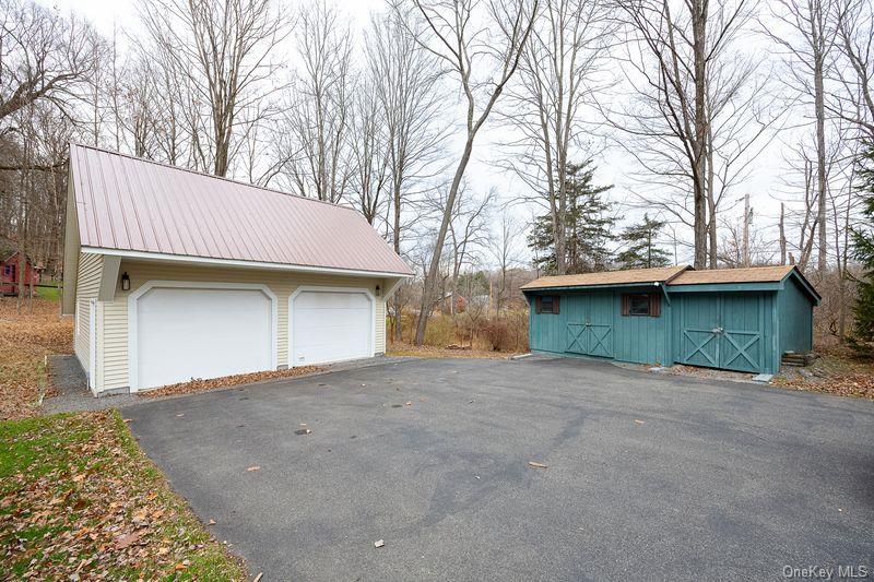 26 St Paul Road Red Hook, NY 12571 - Photo 24 of 35 a front view of a house with a yard and garage