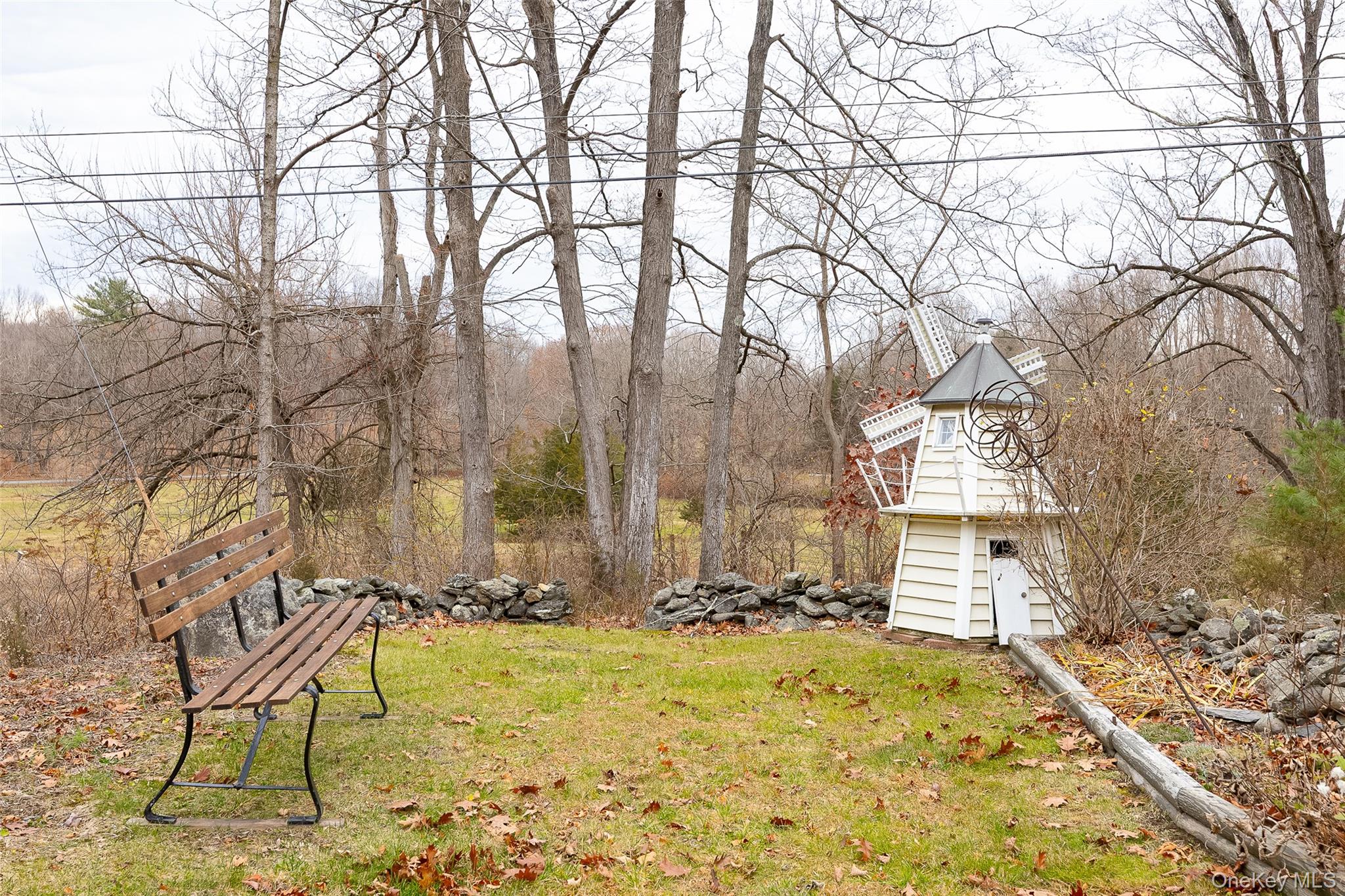 26 St Paul Road Red Hook, NY 12571 - Photo 30 of 35 a backyard of a house with table and chairs