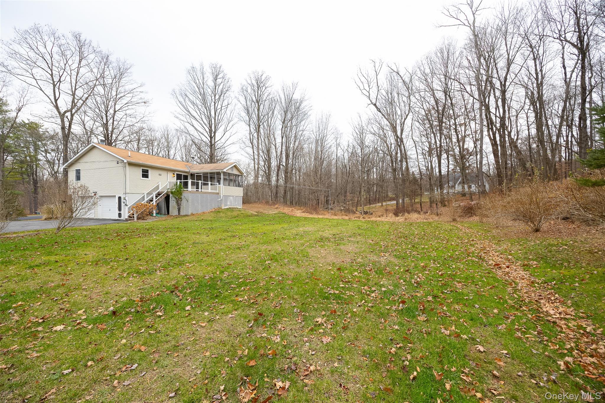26 St Paul Road Red Hook, NY 12571 - Photo 32 of 35 a view of house with backyard and trees